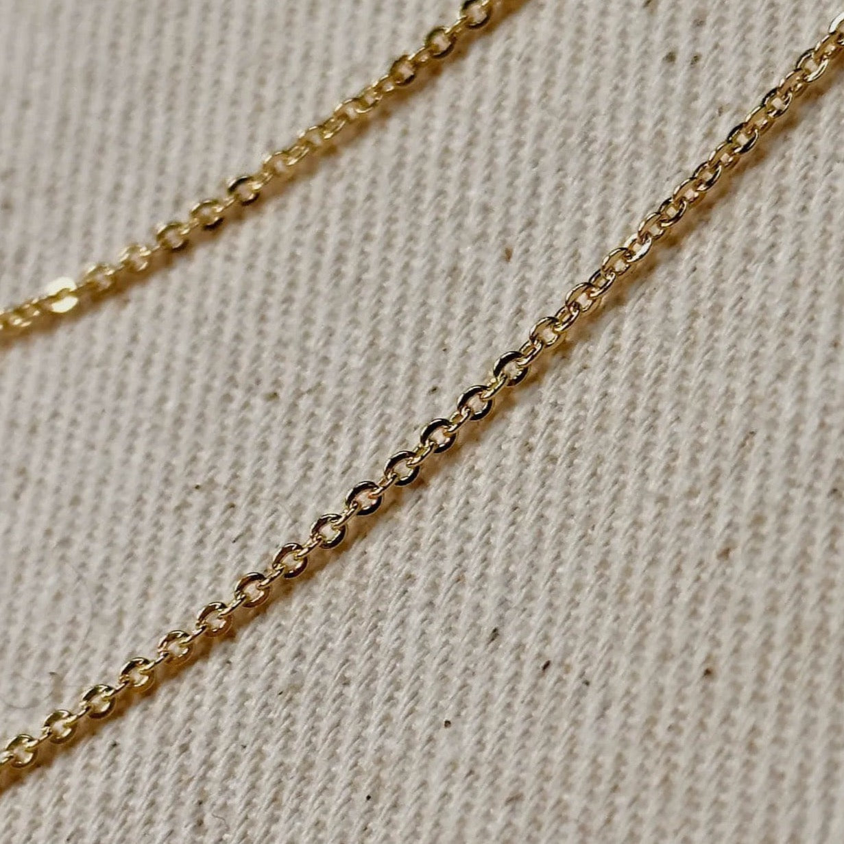 18k Gold Filled material and featuring a delicate 1.45mm width along with a charming moon bar pendant