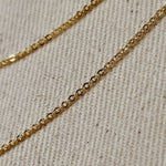 18k Gold Filled material and featuring a delicate 1.45mm width along with a charming moon bar pendant