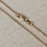 18k Gold Filled material and featuring a delicate 1.45mm width along with a charming moon bar pendant