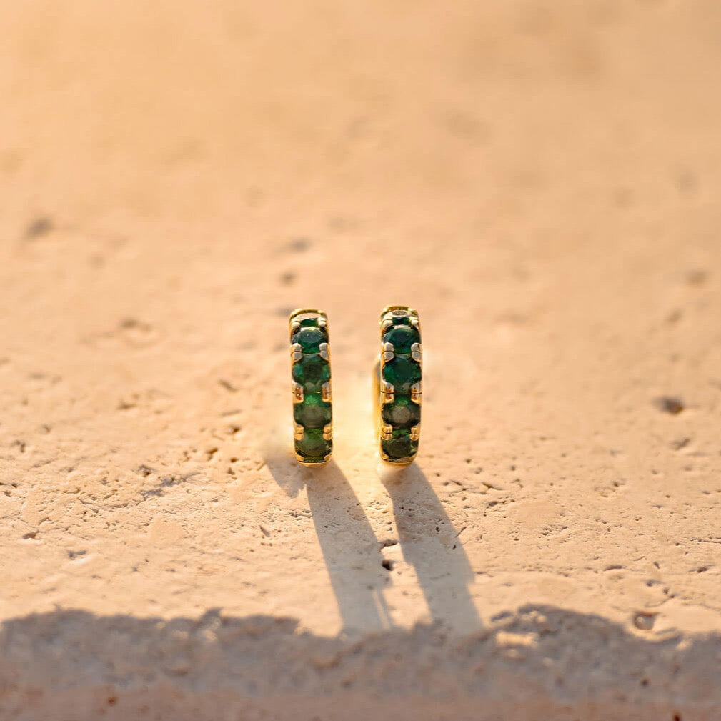 Enhance your summer look with a bold touch of color. Crafted in 24K gold filled these 16.5 MM deep emerald green hoops are a must-have for any fashion-forward individual.
