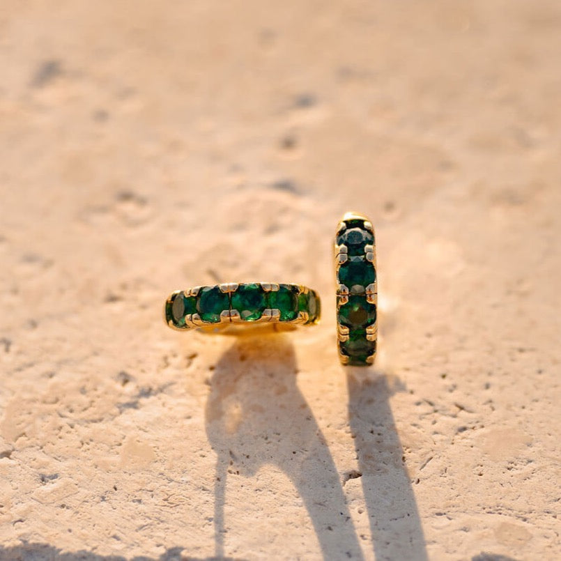 Enhance your summer look with a bold touch of color. Crafted in 24K gold filled these 16.5 MM deep emerald green hoops are a must-have for any fashion-forward individual.